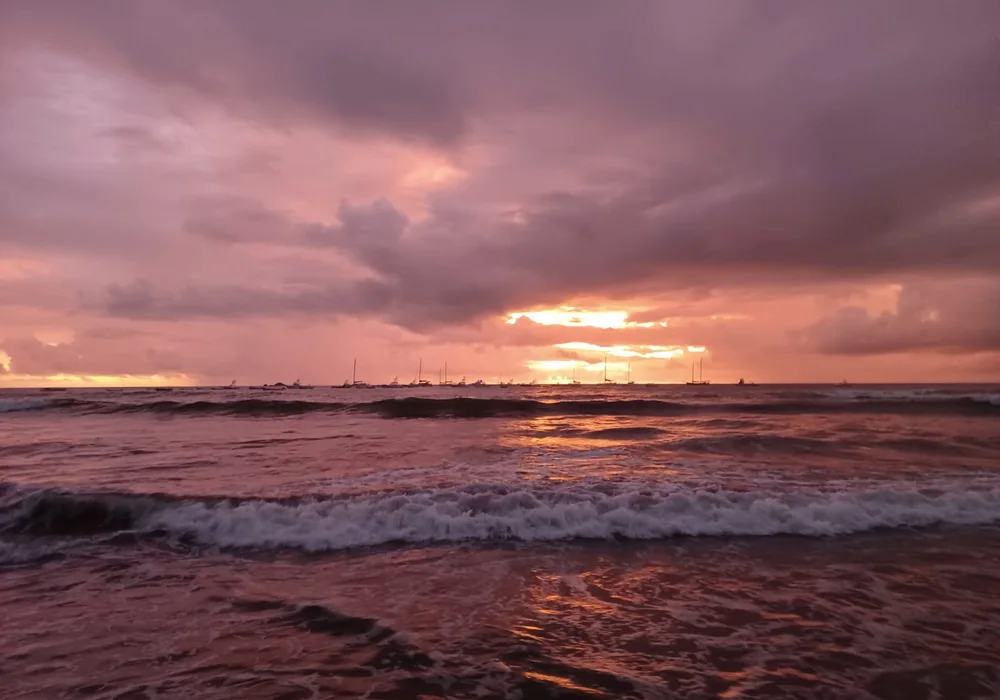 Sunset over the surf beach and estuary at Tamarindo, Guanacaste
